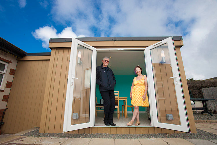 Two people standing in a doorway.