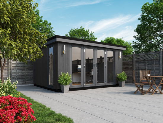 A black clad rubicon garden office with a table and chairs.