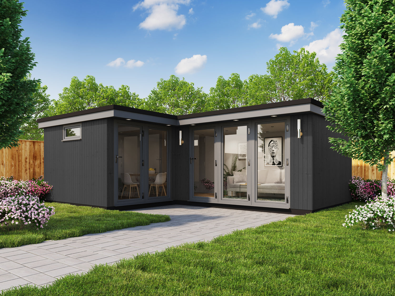 A black and grey composite garden room in the corner of a garden.