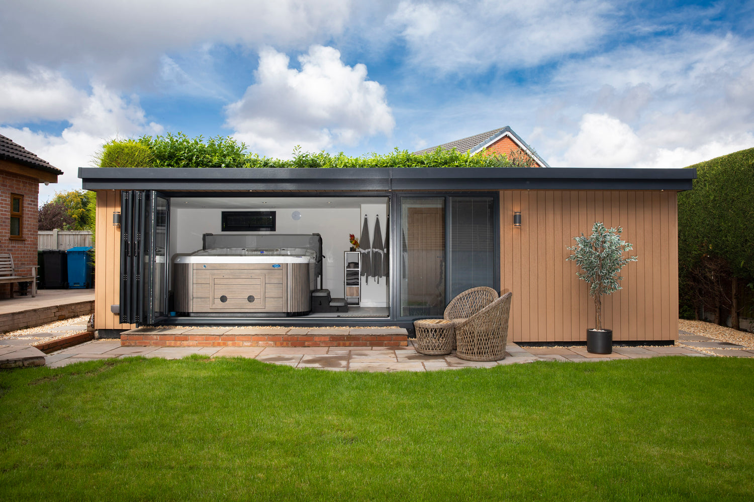 A garden room annexe in Chester, Cheshire with a hot tub and sliding aluminium doors