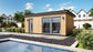 Modern pool house with composite cladding, designed as an Annexe Style Bespoke by Rubicon Garden Rooms adjacent to an outdoor swimming pool.