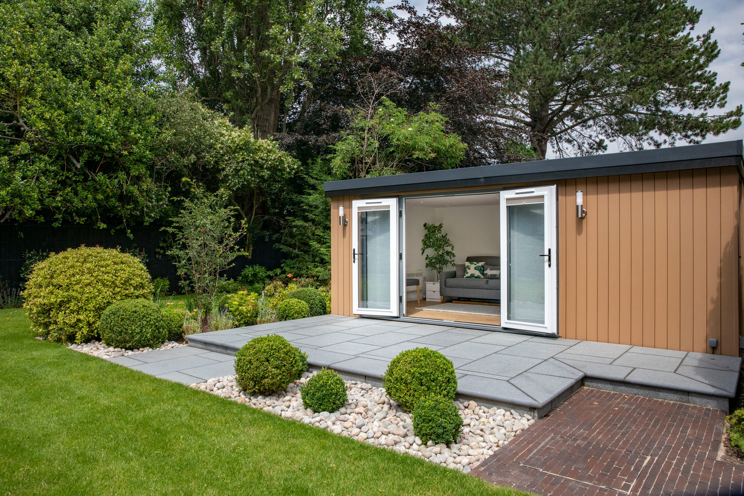 A garden room office in Nantwich with large patio in front