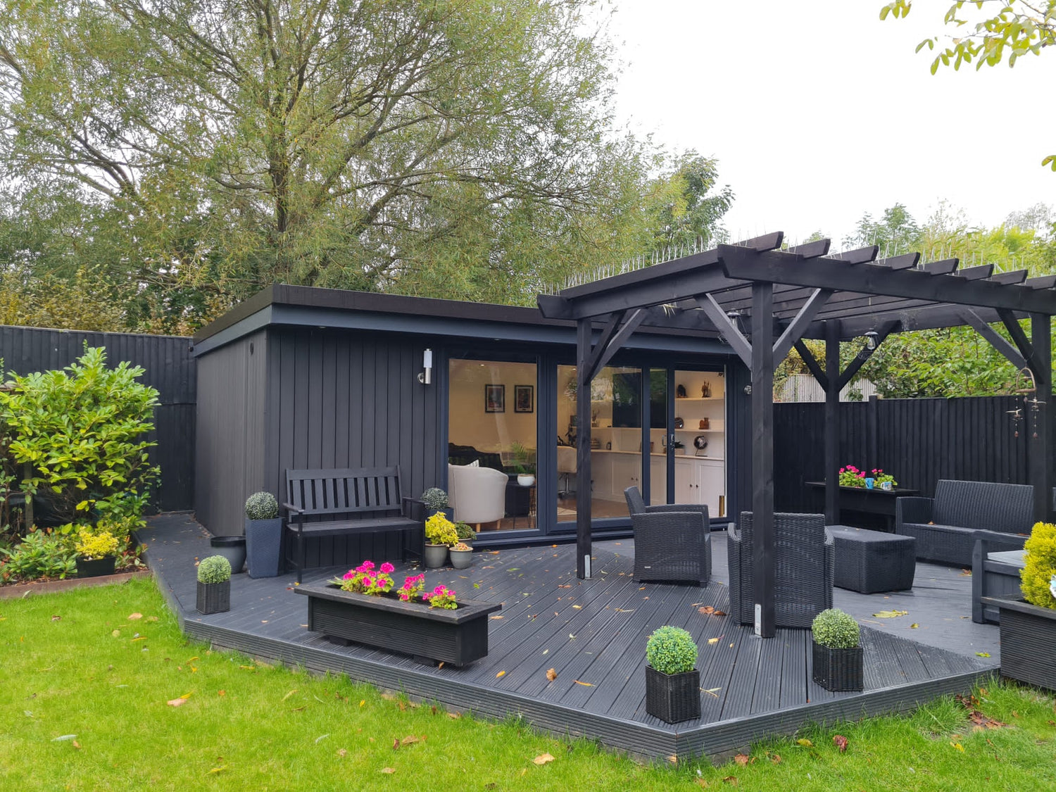 A luxury composite garden room office in Wirral with decking