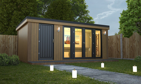A building with a fence, lights, and Rubicon Garden Rooms Combi Style.