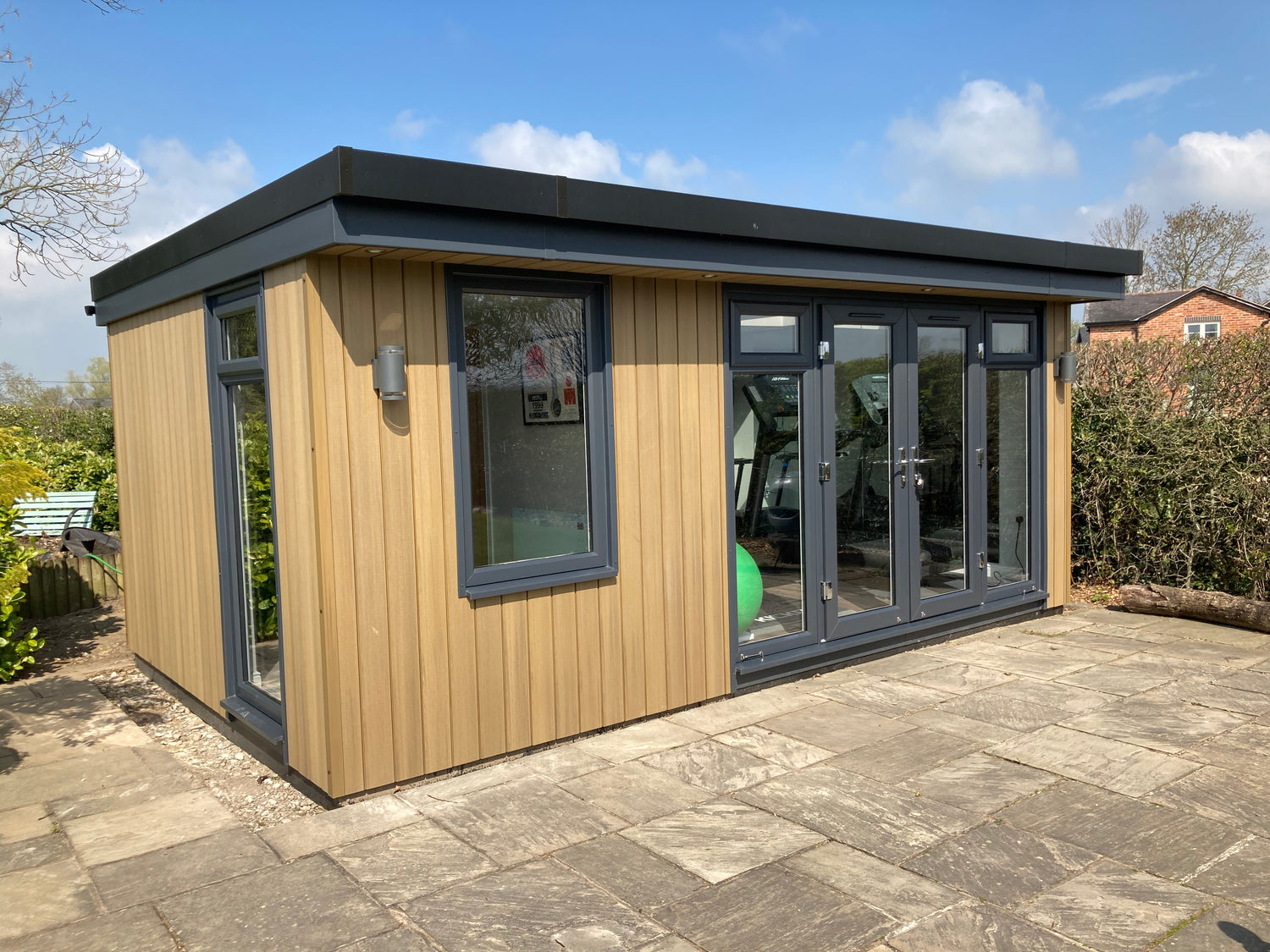 A small garden room gym with an integral office in Warrington, Cheshire