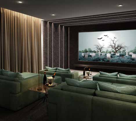 A home theater with green couches and a large screen.