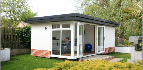 A small home gym with a glass door.