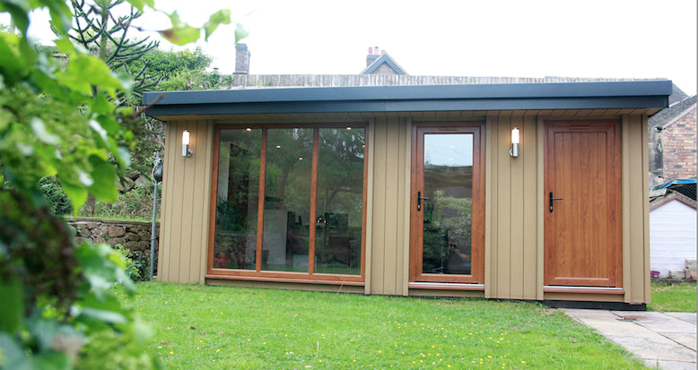 A small garden shed in a garden.