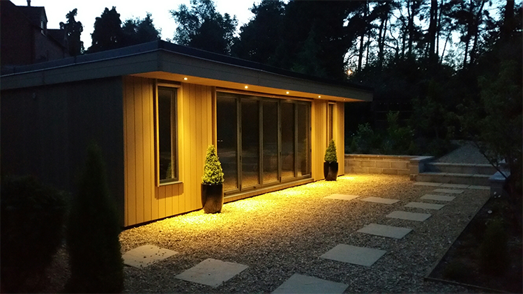 A night scene with lighting of a garden room office in Frodsham, Cheshire
