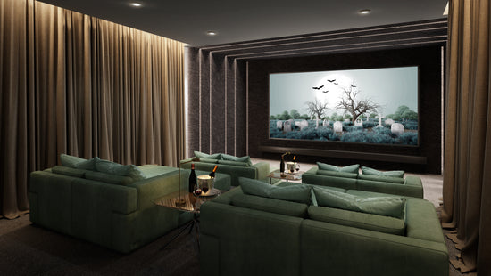 A living room with green couches and a movie screen.
