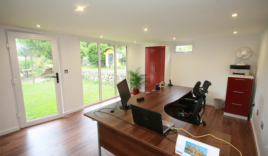 A home office with a desk and a computer.